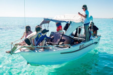 Michelle Lee and her family riding a boat